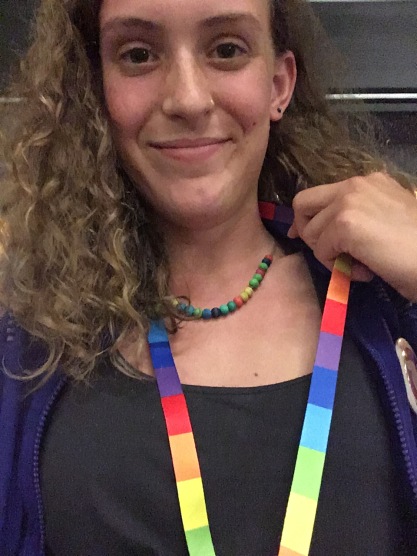 Wearing a tempestry necklace for climate advocacy.